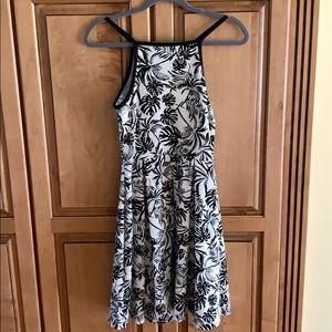 white dress with leaves/flower details